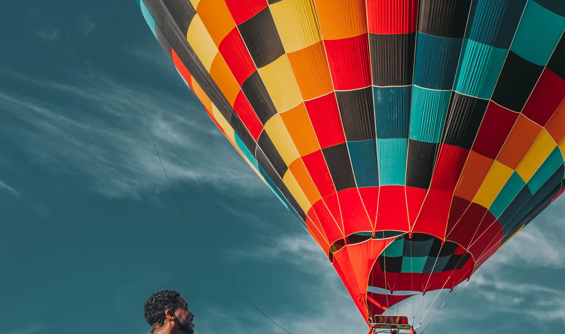 People enjoying a colourful hot-air balloon experience